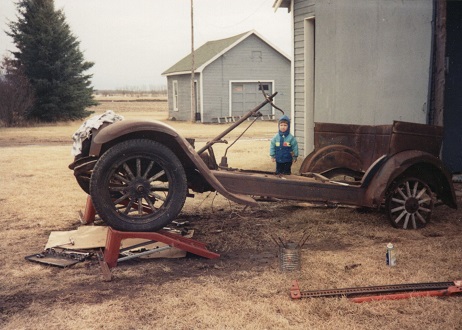 Louis' old Chev that he restored. Standing: Leelan Louis' old Chev that he restored. Standing: Leelan
