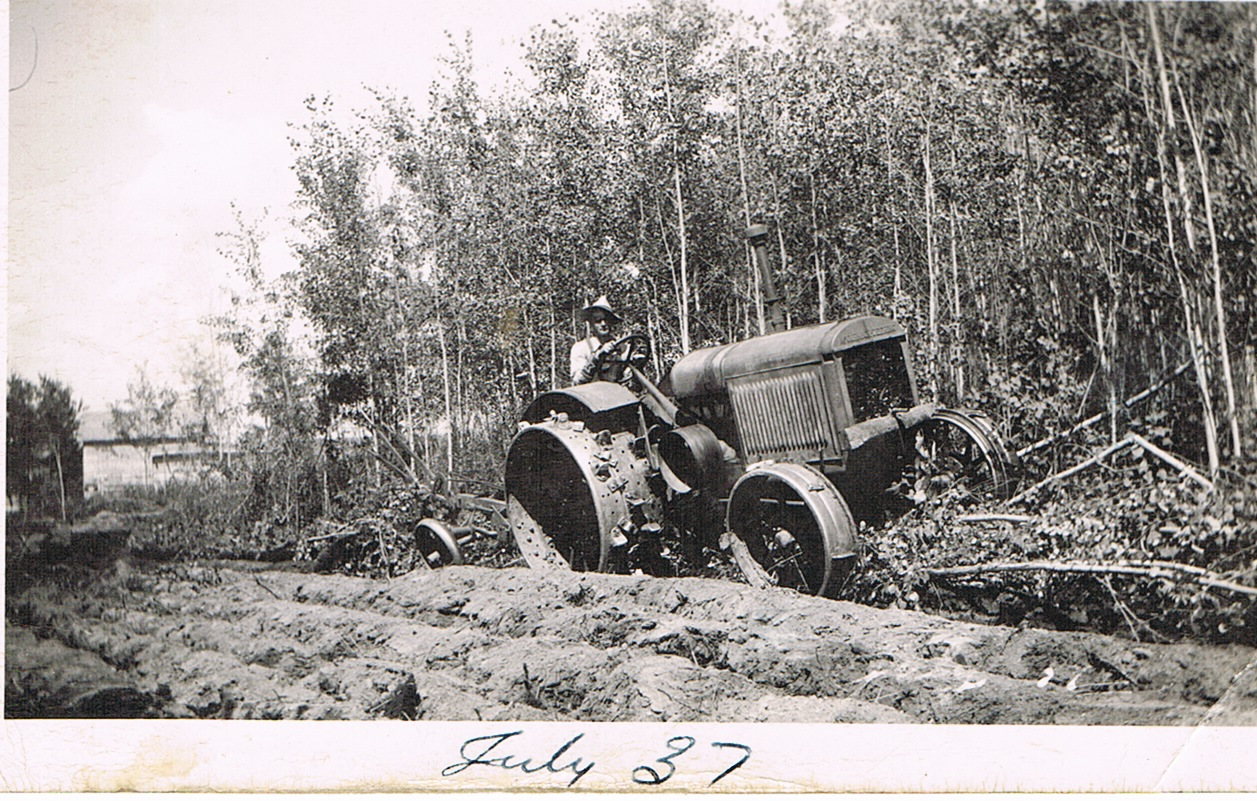 Eric Brown, breaking land with IHC 15-30, east of Bird store – Meanook, 1937 Eric Brown, breaking land with IHC 15-30, east of Bird store – Meanook, 1937