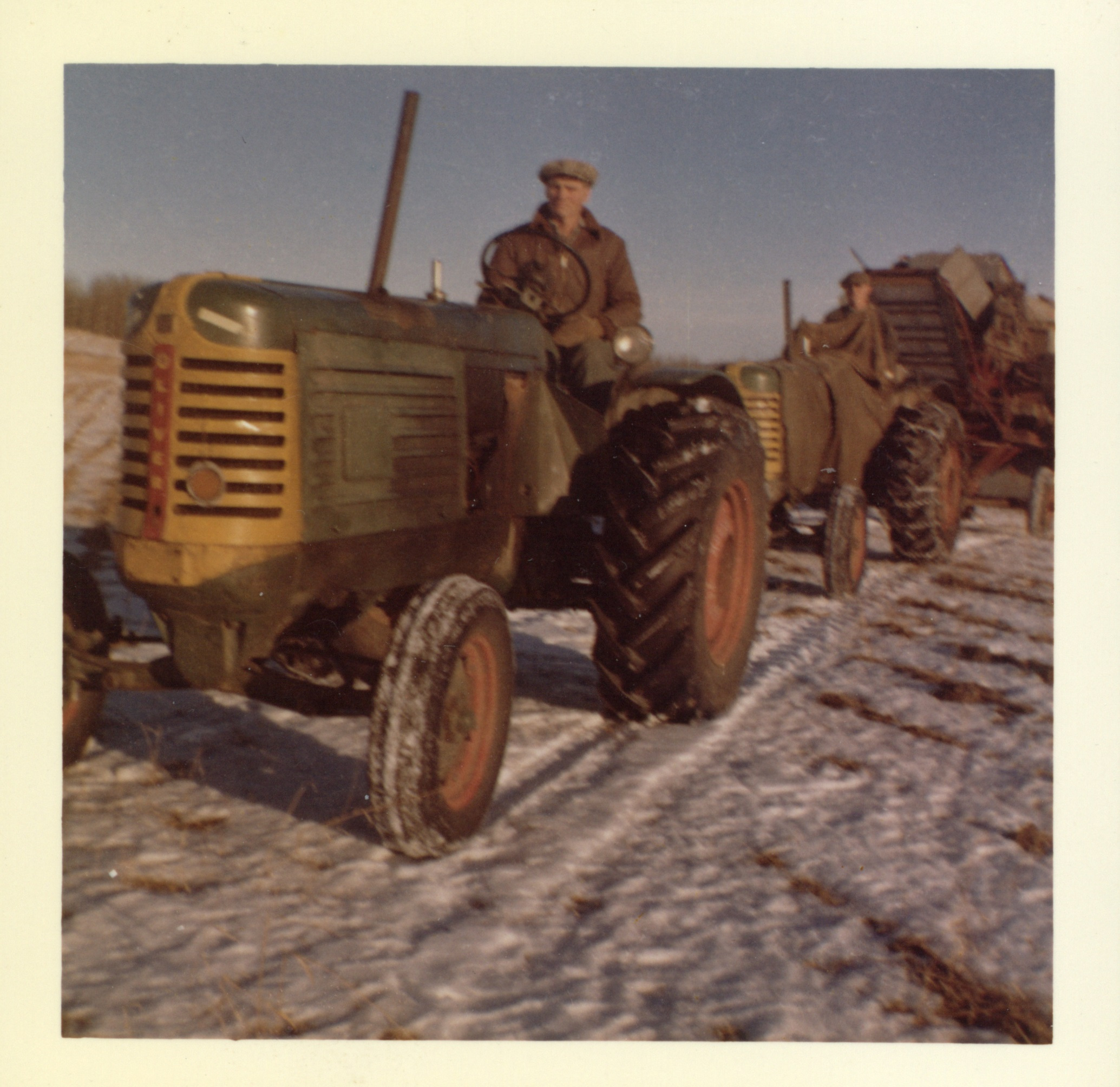 Eric and Nelson Brown on Oliver tractors pulling threshing machine – Meanook, December 1960 Eric and Nelson Brown on Oliver tractors pulling threshing machine – Meanook, December 1960