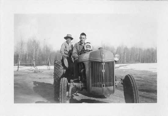 Larry, Dick, Raymond on tractor