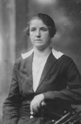 (a) Julia's passport photo, front. 1930. (a) Julia's passport photo, front. 1930.