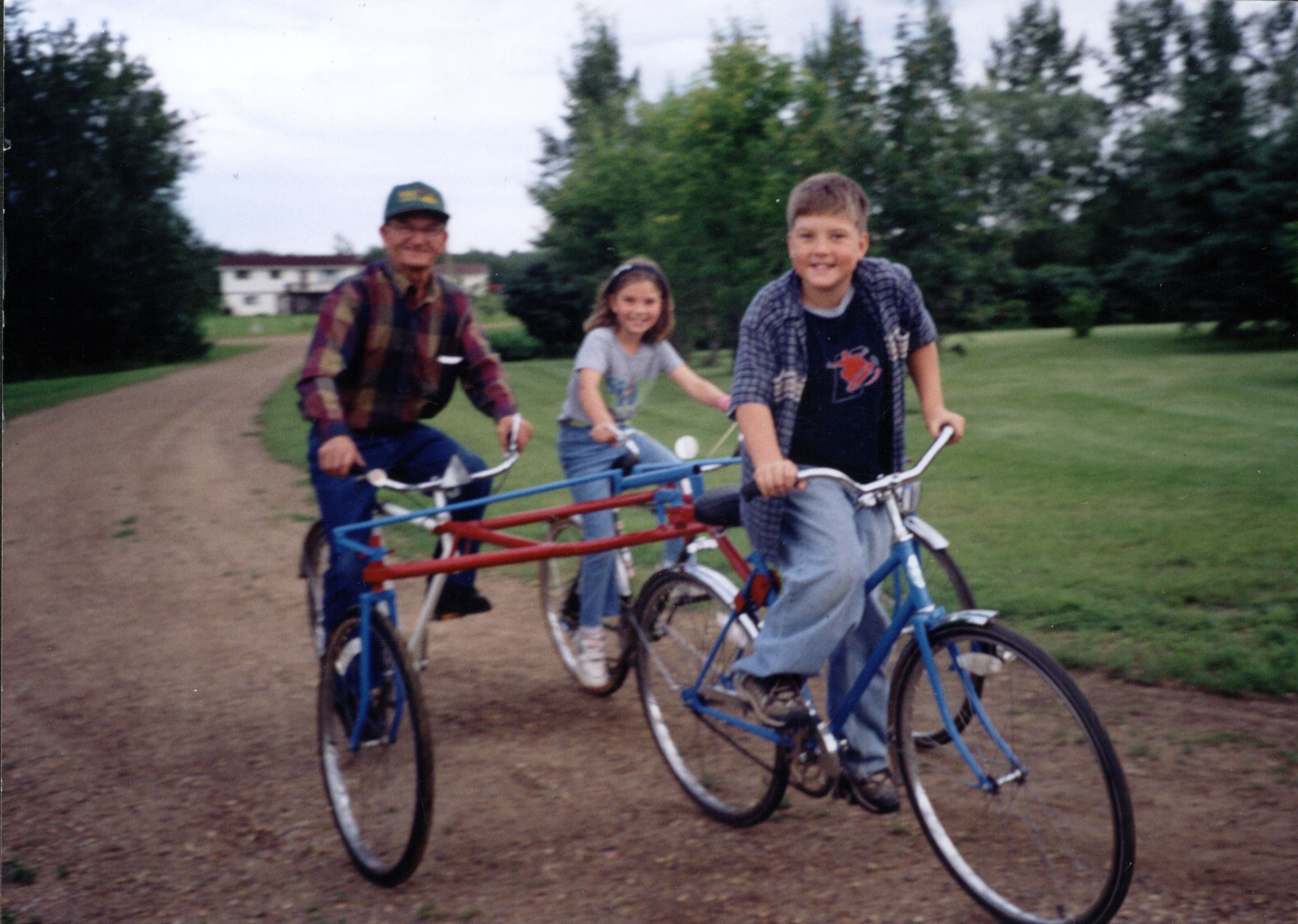 Nick on his bicycle invention with grandchildren Chantelle and Clinton. Nick on his bicycle invention with grandchildren Chantelle and Clinton.