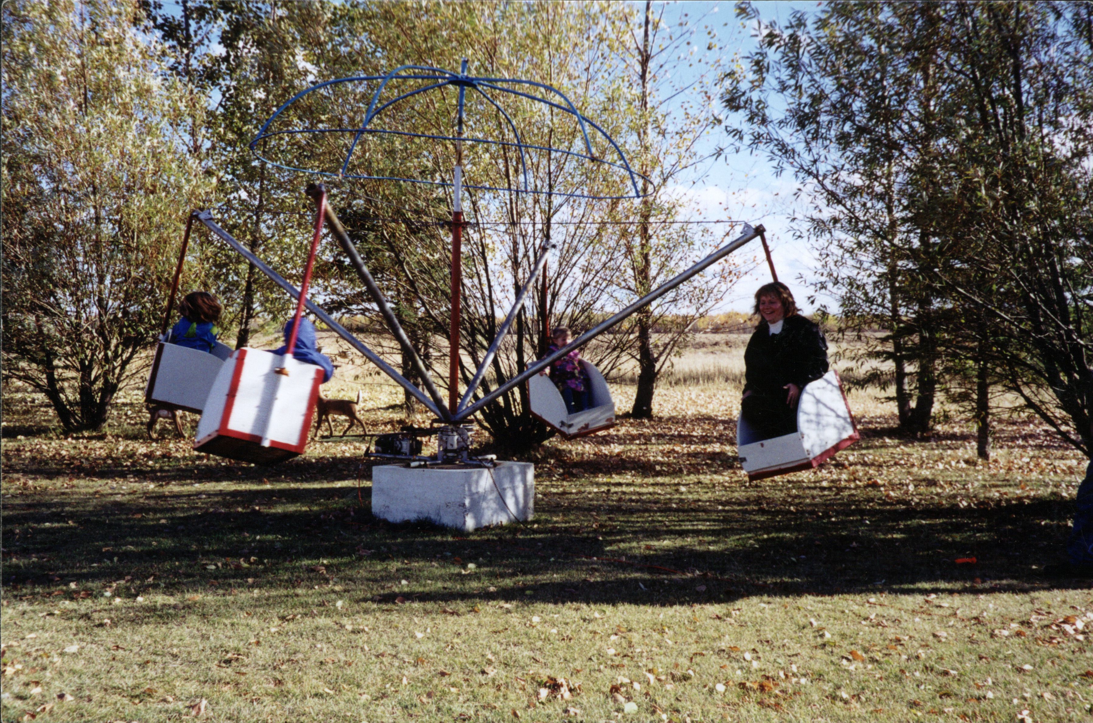 Nick's merry-go-round invention with grandchildren. Nick's merry-go-round invention with grandchildren.