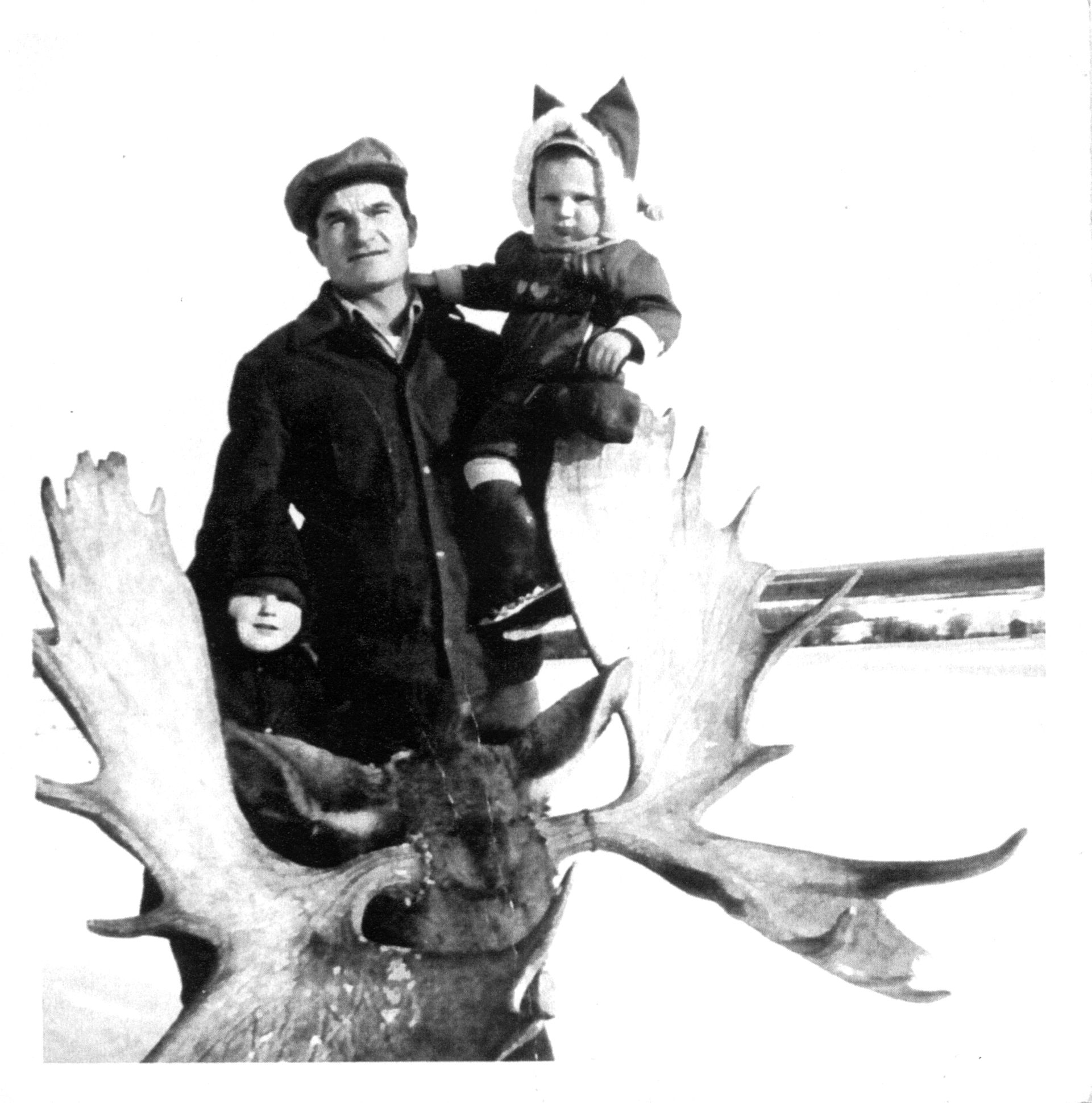 Nick with sons Vince (standing on left) and Wayne (right), posing with moose killed near Baptiste Lake. 1960s. Nick with sons Vince (standing on left) and Wayne (right), posing with moose killed near Baptiste Lake. 1960s.