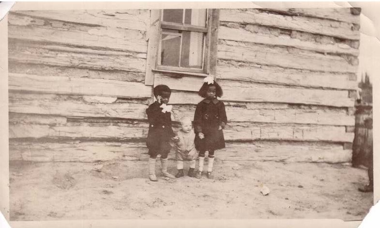 From left to right – Shirley’s uncle and mother – Chris and Velma Adams – with unidentified toddler - Toles School, Amber Valley (ca. 1920) From left to right – Shirley’s uncle and mother – Chris and Velma Adams – with unidentified toddler - Toles School, Amber Valley (ca. 1920)
