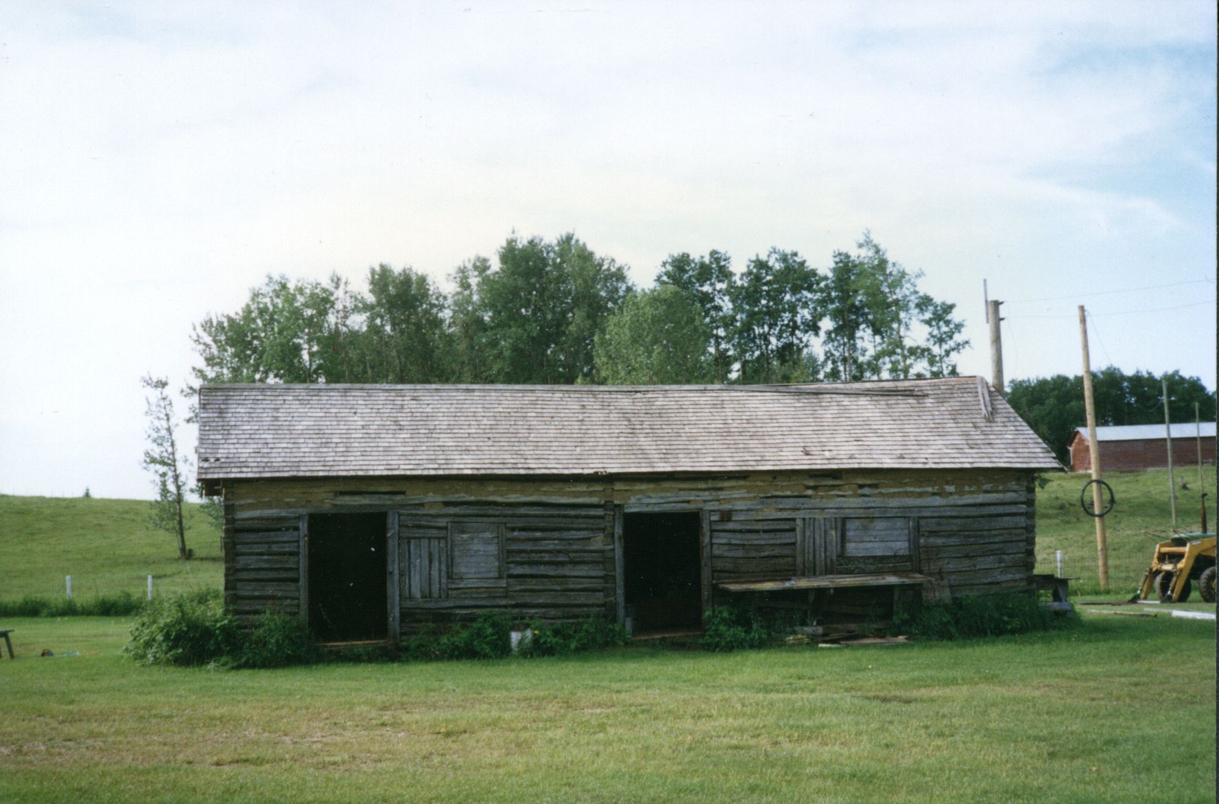 Original homestead log granary built about 1933. 1997 photo. Original homestead log granary built about 1933. 1997 photo.