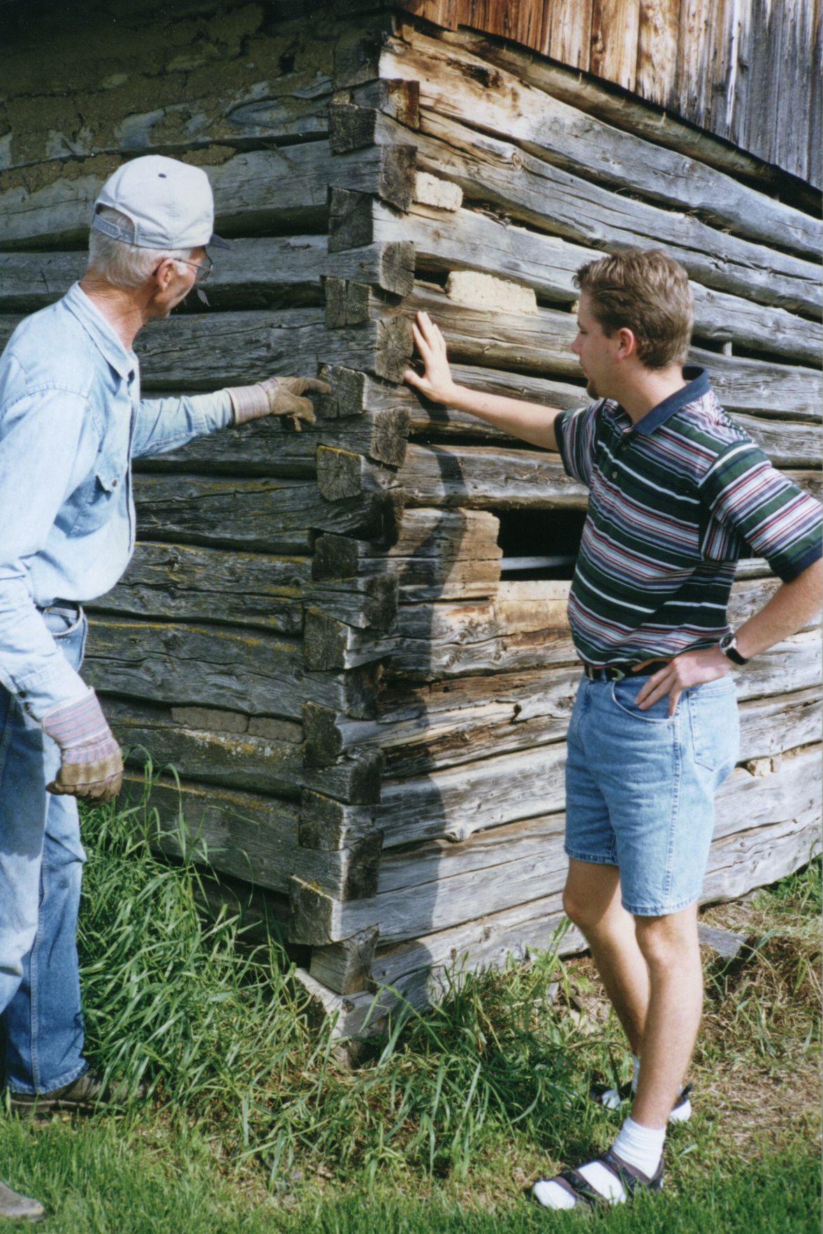 1997 photo showing dovetail work on original homestead log granary, built in 1933 by Ted's maternal great-grandfather, Motkoski, and his sons. Ted and son Roland in photograph. 1997 photo showing dovetail work on original homestead log granary, built in 1933 by Ted's maternal great-grandfather, Motkoski, and his sons. Ted and son Roland in photograph.