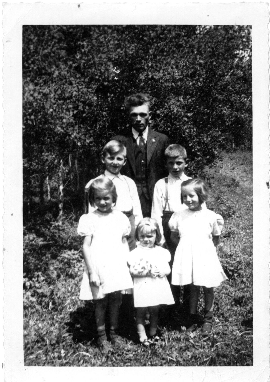 Dmytro Turkawski (father), Ted on left, Mike on right, Victoria on left, Evangeline on right, and Irene in the centre. Circa 1947. Dmytro Turkawski (father), Ted on left, Mike on right, Victoria on left, Evangeline on right, and Irene in the centre. Circa 1947.